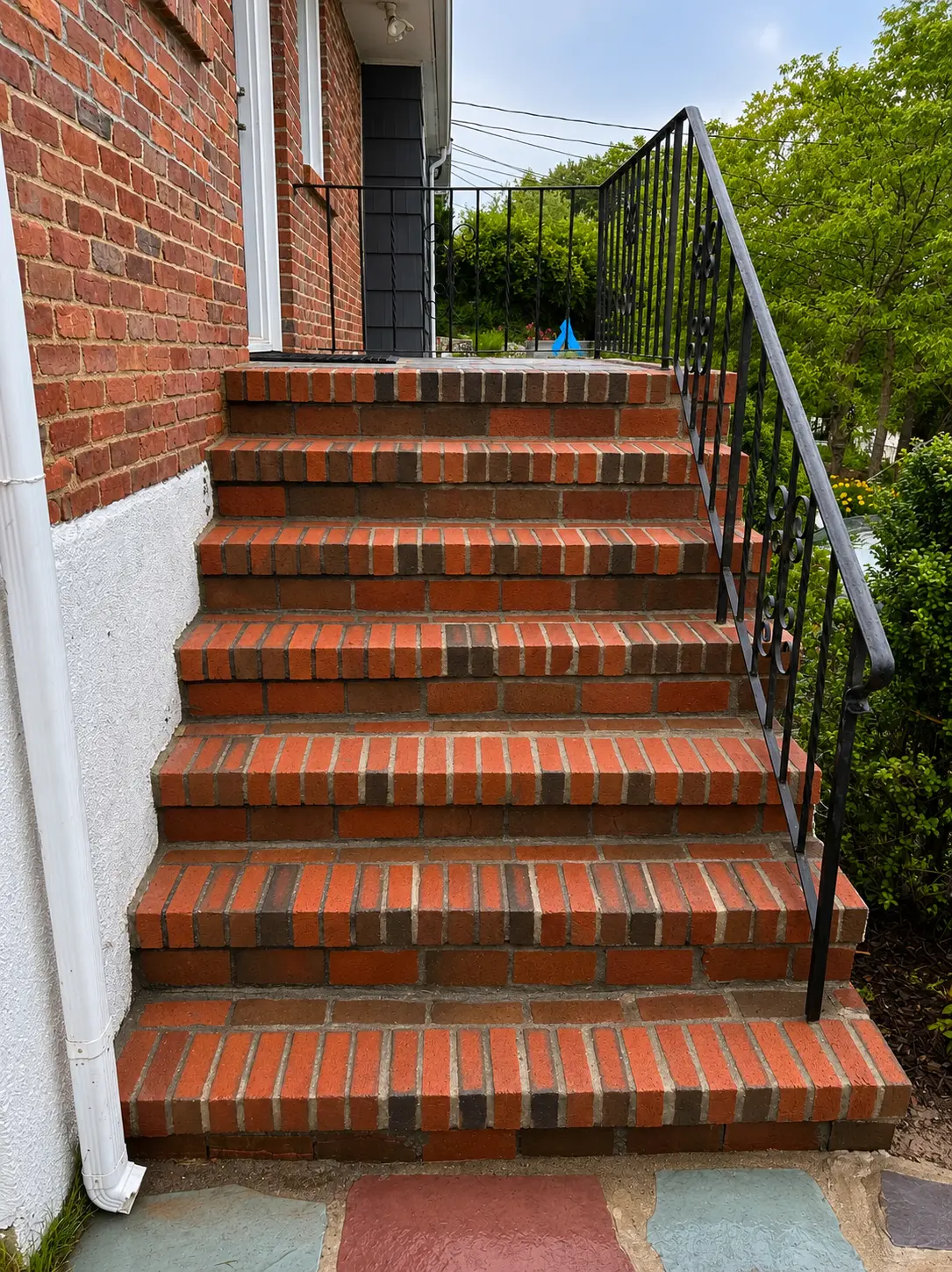 Brick front steps in Scarborough after repointing and restoration: clean, level treads and crisp mortar joints